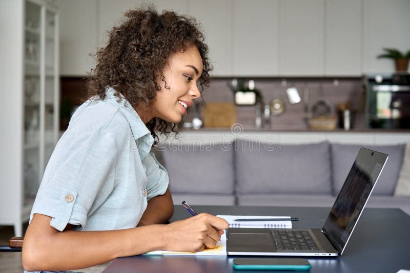 Friends Using Laptop On Sofa Mixed Race Typing Having Photo