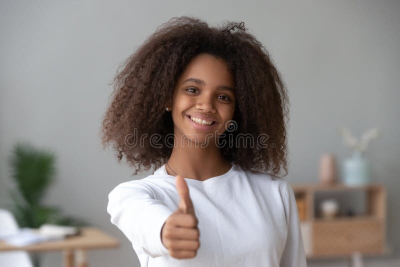 Happy African American teenage girl show thumbs up stock photos Happy African American teenage girl show thumbs up stock photos