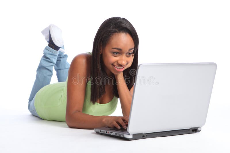 Happy African American teenager girl on internet