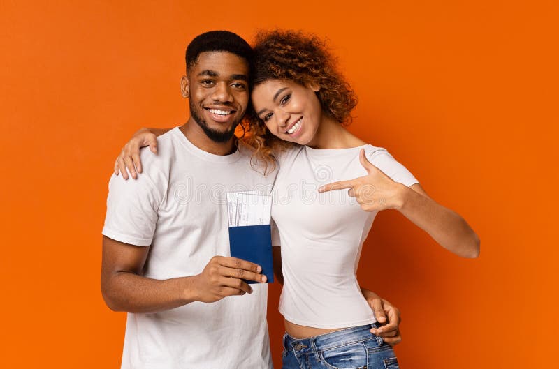 Happy african couple enjoying future vacation with passports and tickets royalty free stock photo Happy african couple enjoying future vacation with passports and tickets royalty free stock photo