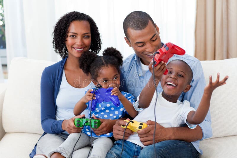 Happy Afro-american family playing video games royalty free stock image Happy Afro-american family playing video games royalty free stock image