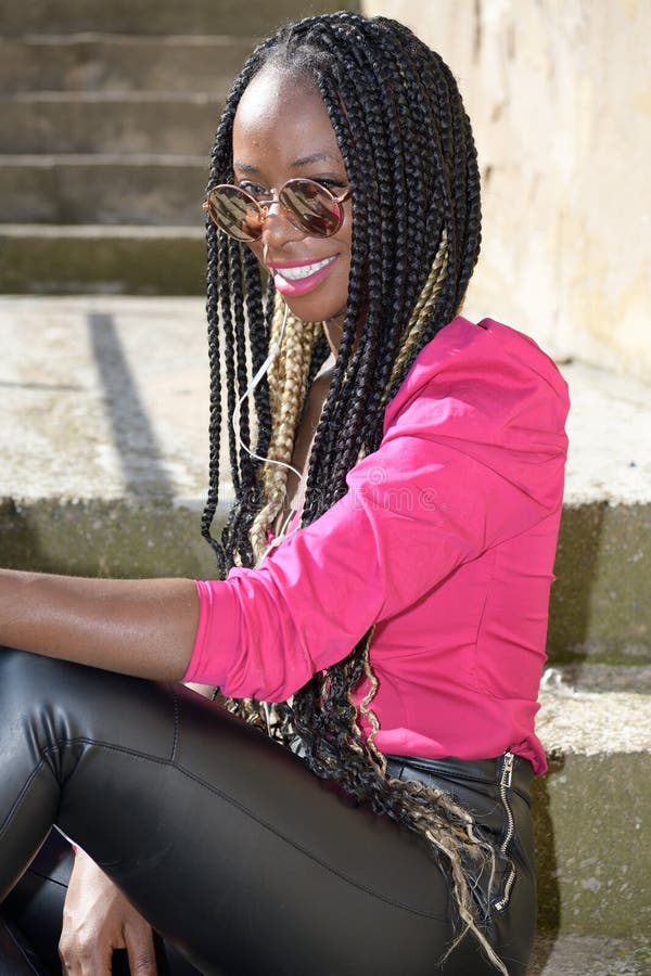 Happy Afro Style Black Girl With Long Black And Blondes Braids Wearing Big Shoes And Sunglasses