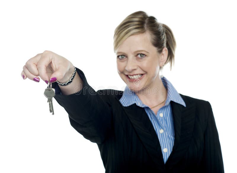 Happy aged woman holding keys, offering them to you