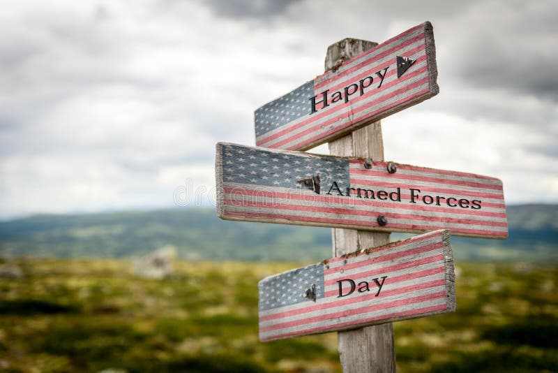 Happy armed forces day text on wooden american flag signpost outdoors