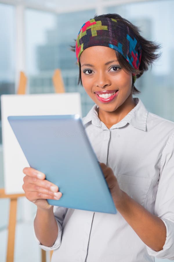 Happy artist using tablet stock photography