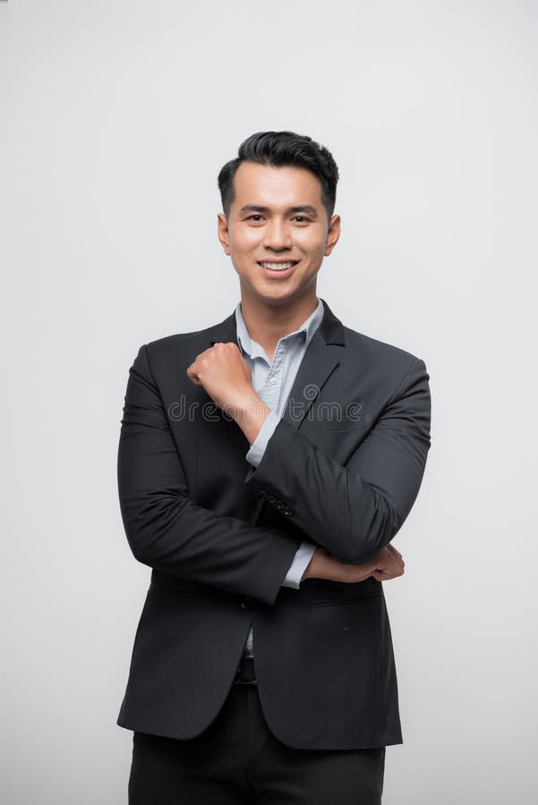Happy Asian boss manager business man wears black suit in relax pose royalty free stock photography Happy Asian boss manager business man wears black suit in relax pose royalty free stock photography