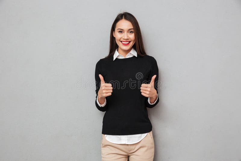 Happy asian business woman in business clothes showing thumbs up stock photos Happy asian business woman in business clothes showing thumbs up stock photos