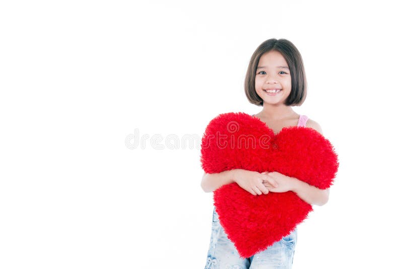 Happy Asian cute girl holding heart royalty free stock images Happy Asian cute girl holding heart royalty free stock images