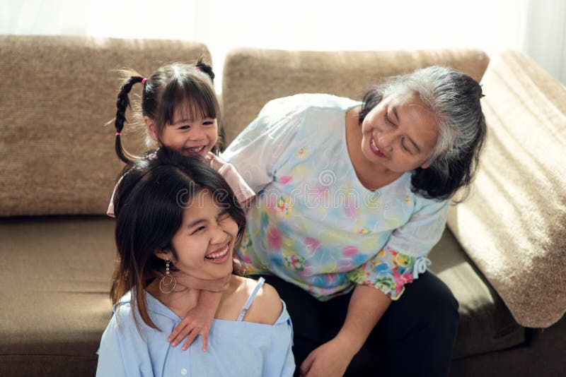 Happy Asian Man Giving Gift Box To His Mother For Mother's Day Celebration.  Stock Photo, Picture and Royalty Free Image. Image 129902480.