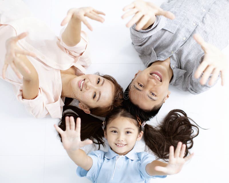 Happy asian Family lying on the floor royalty free stock photos Happy asian Family lying on the floor royalty free stock photos