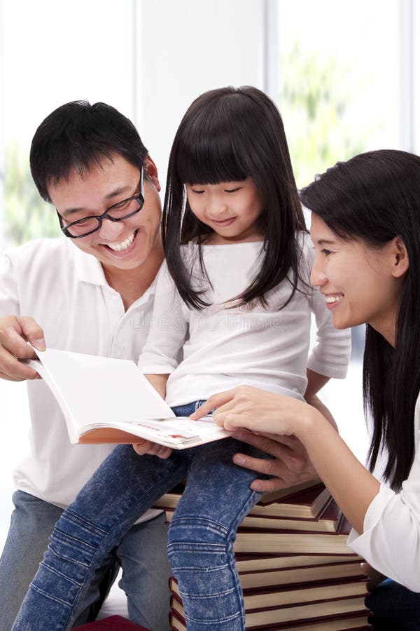 Happy asian family studying together