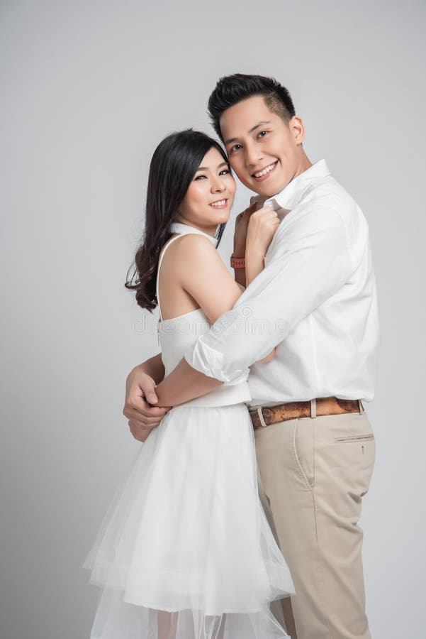 Happy Asian Groom Embracing His Bride in Casual Wedding Dress Stock Image -  Image of asian, portrait: 179817951