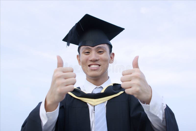 Happy asian male graduate