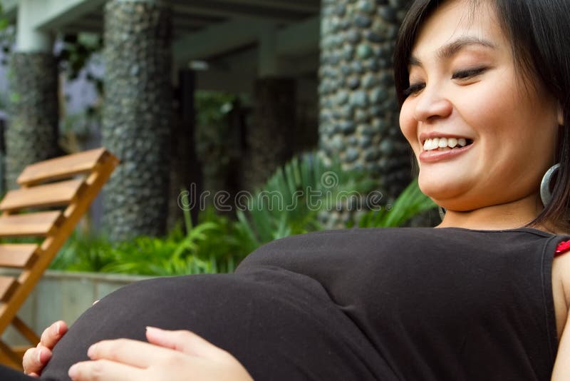 Happy Asian pregnant woman