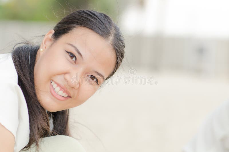 Happy Asian Woman play Castle Sand