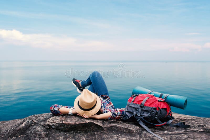 Happy Asian woman relaxing on holiday travel concept stock photo Happy Asian woman relaxing on holiday travel concept stock photo