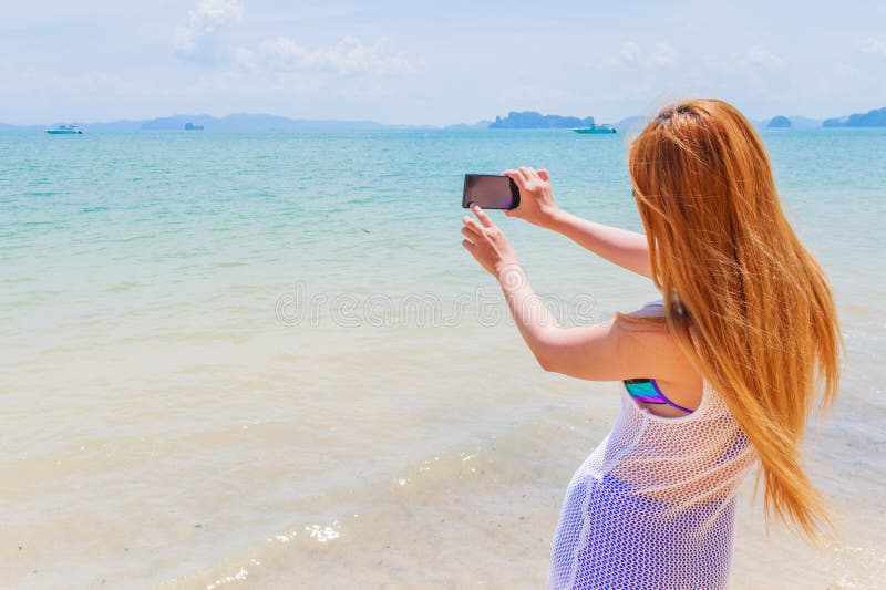 Happy Attractive Blonde In Bikini Taking A Self Picture On A Beautiful