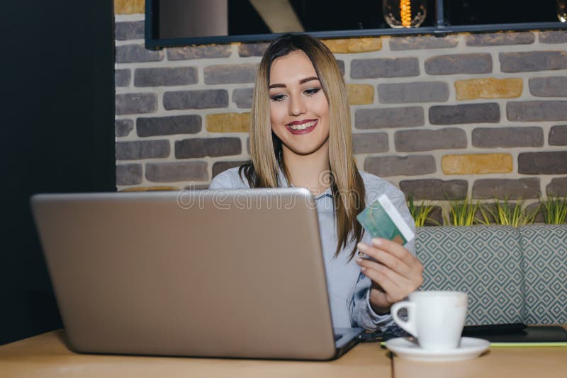 Happy attractive woman paying on line royalty free stock image Happy attractive woman paying on line royalty free stock image