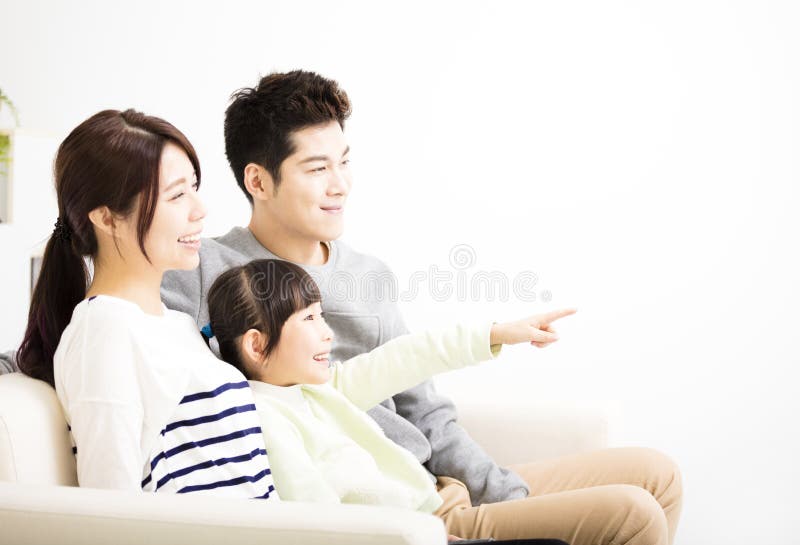 Happy Attractive Young Family watching the tv stock photography Happy Attractive Young Family watching the tv stock photography