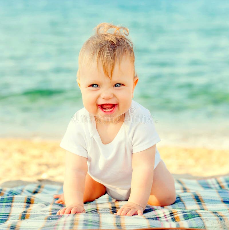 Happy Baby on the Beach at the Seaside. Stock Image Image of ocean