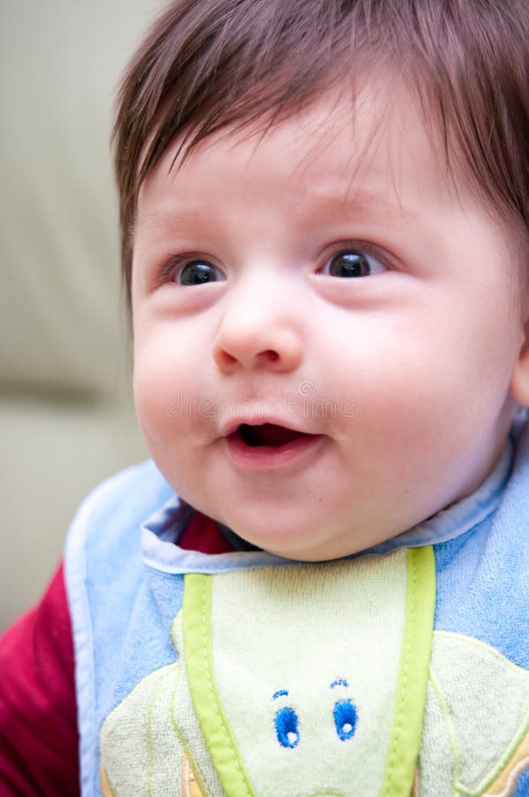 Happy baby boy in bib