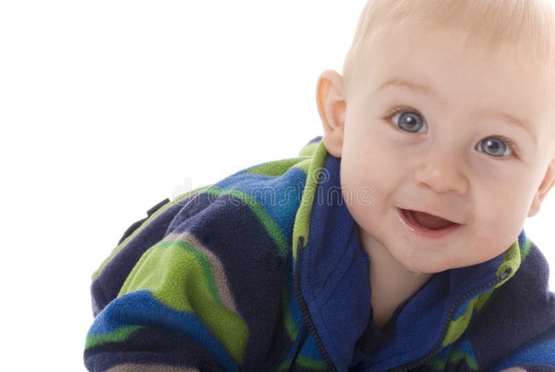 Happy baby boy crawls towards camera