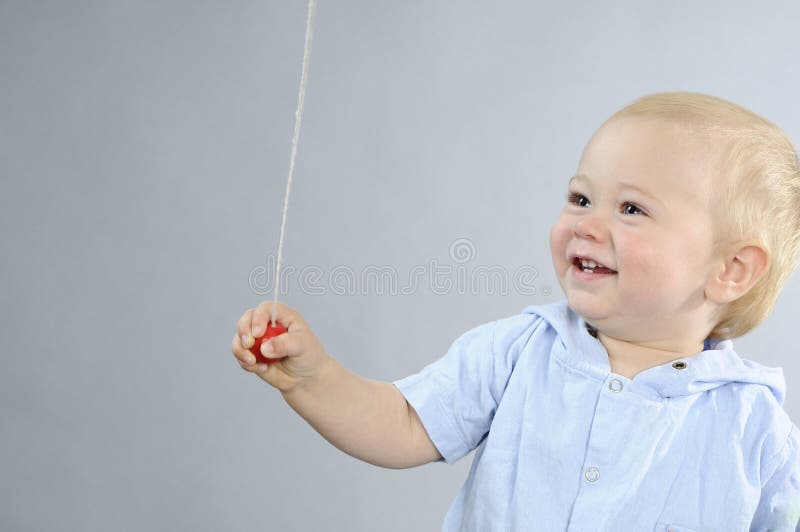 Happy baby boy playing