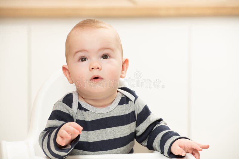 Happy Baby Boy Sitting in High Chair Stock Photo Image of sitting