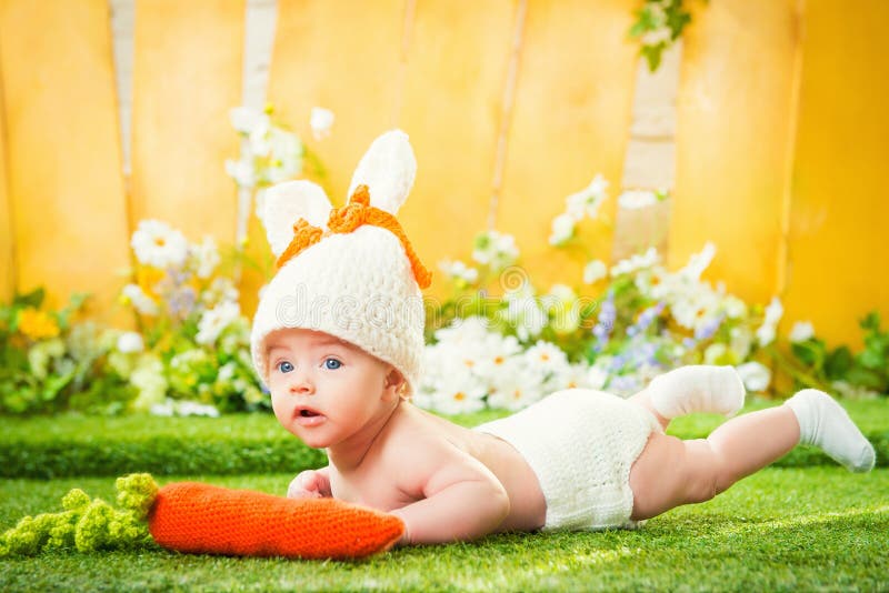 Happy baby child in costume a rabbit bunny with carrot stock photos Happy baby child in costume a rabbit bunny with carrot stock photos