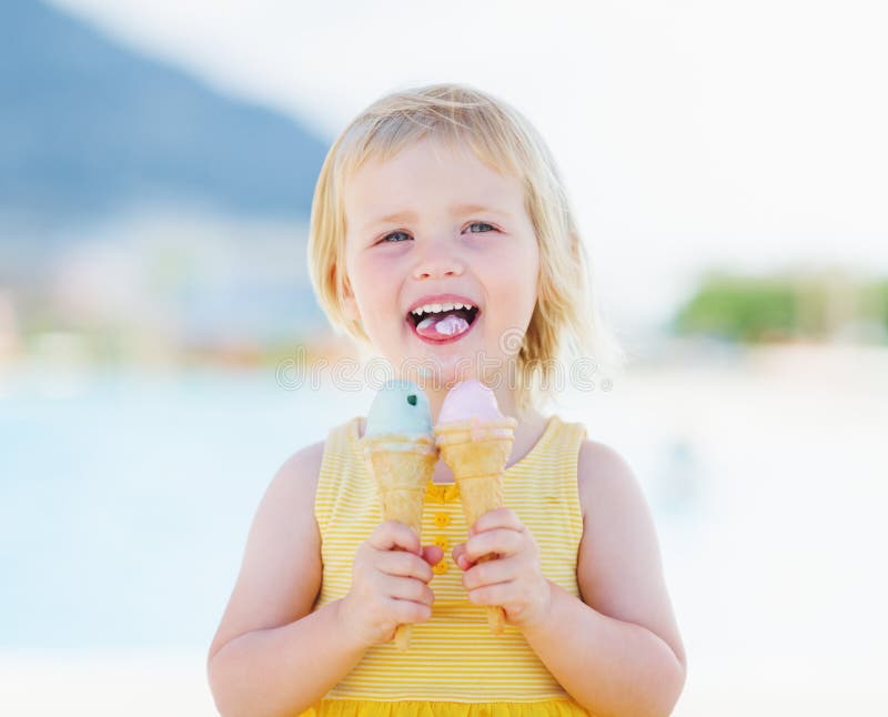 Happy Baby Eating Two Ice Cream Stock Photo Image of enjoy, blond