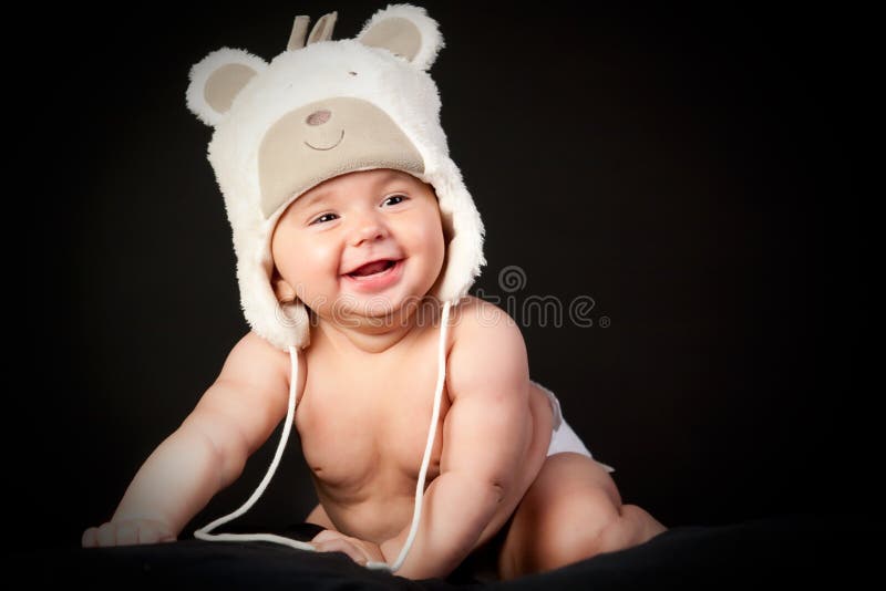 Happy baby in fun cap