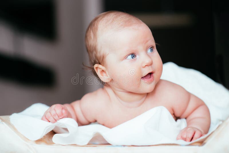 Happy Baby Girl Lies On A White Sheet In Her Room Stock Image Image