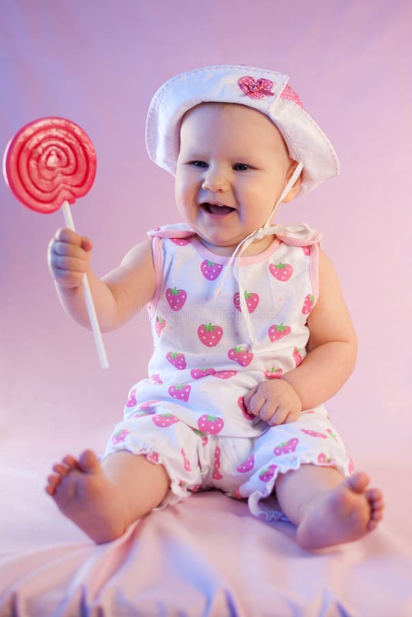 Happy baby girl lollipop
