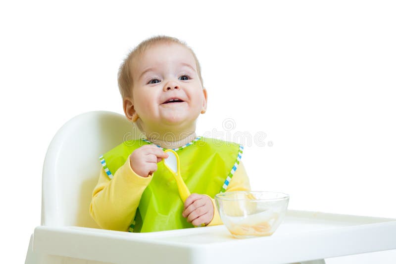 Happy baby kid waiting for food with spoon royalty free stock images Happy baby kid waiting for food with spoon royalty free stock images