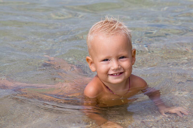 Happy baby at the sea