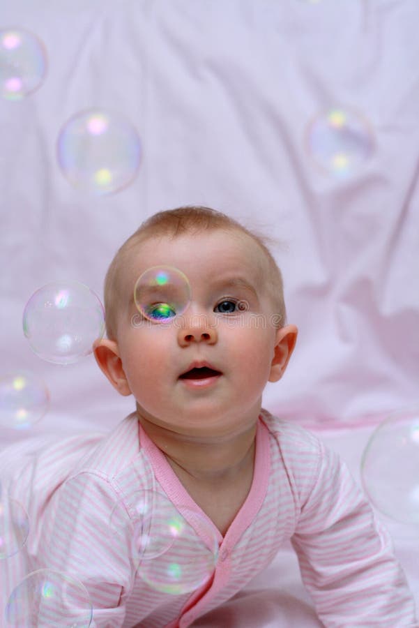 Happy baby and soap bubbles