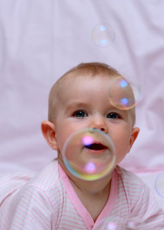 Happy baby and soap bubbles