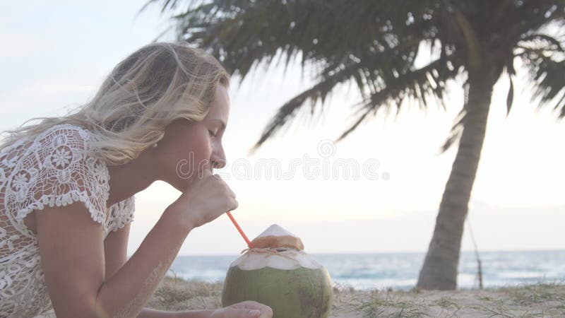 Happy Beach Bikini Woman Relaxing Drinking Fresh Coconut Water Lying Down Sunbathing On Fun 