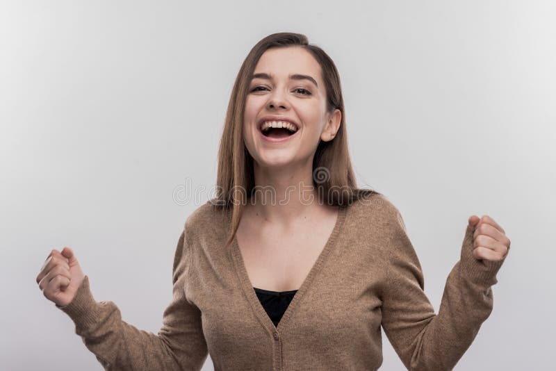 Happy beaming student feeling extremely satisfied after passing exam