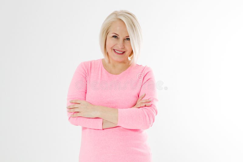 Happy beautiful close up portrait middle age blonde woman. Mid aged healthy female isolated on white background with copy space. Menopause and healthcare. Mature lady wrinkled face. Folded hands