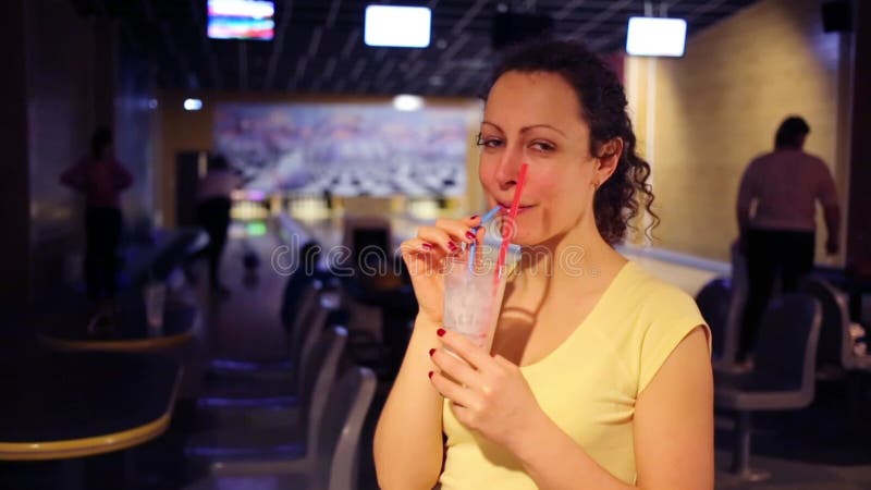 Happy beautiful woman drinks milk cocktail in stock video
