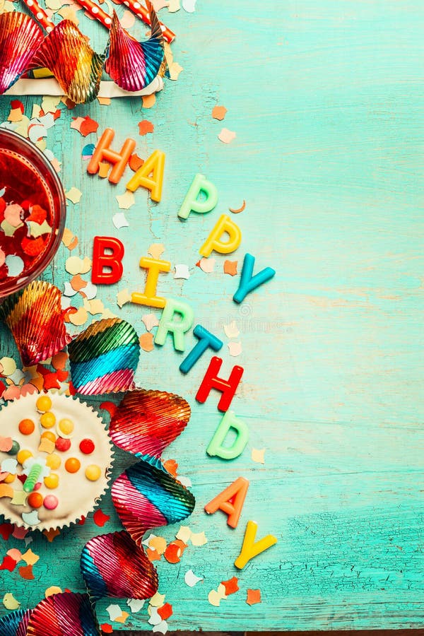 Happy birthday background with lettering, red decoration, cake and drinks , top view, place for text, vertical stock image Happy birthday background with lettering, red decoration, cake and drinks , top view, place for text, vertical stock image
