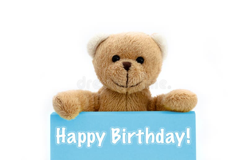 Happy Birthday blue card with brown teddy bear holding with the two hands the note with the message. stock photo Happy Birthday blue card with brown teddy bear holding with the two hands the note with the message. stock photo