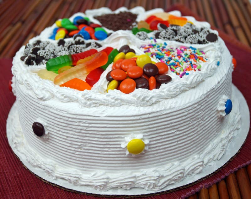 A traditional birthday cake decorated with assorted candy. A traditional birthday cake decorated with assorted candy