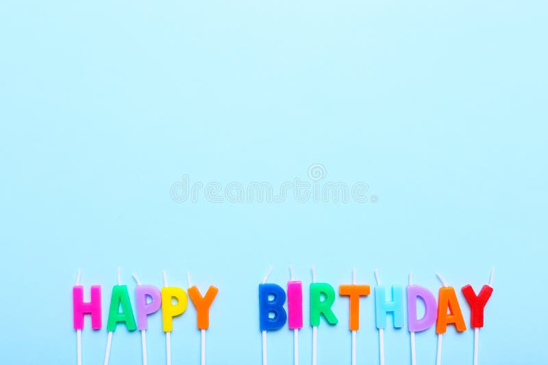 Happy Birthday Candles on Blue Background with Copy Space Stock Image