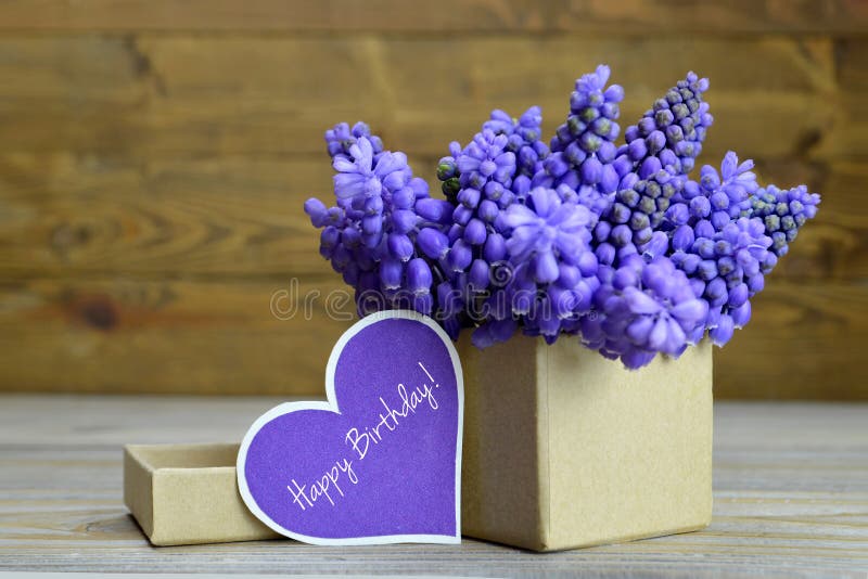 Happy Birthday card and muscari flowers arranged in gift box