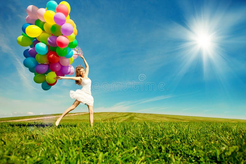 Happy birthday woman against the sky with rainbow-colored air ba stock images Happy birthday woman against the sky with rainbow-colored air ba stock images