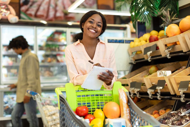 Black Female Buyer Posing with Grocery Shopping List in Supermarket ...