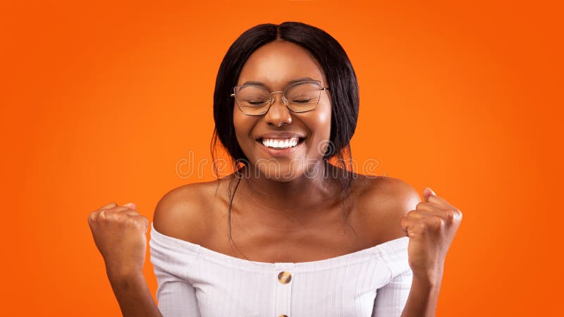 Happy Black Woman Gesturing Yes Over Orange Studio Background, Panorama