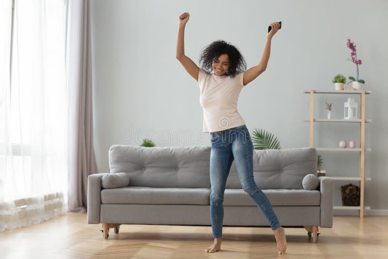 Happy Black Woman Have Fun Dancing in Living Room Stock Photo - Image ...